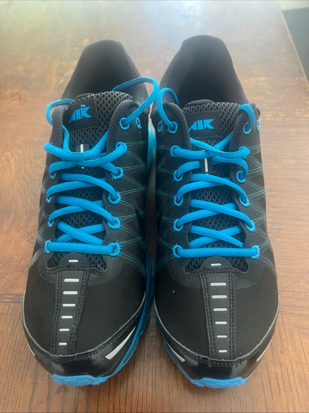 Nike Men’s Black Sneakers with Bright Blue Accents